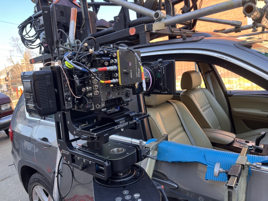 Camera hood-mounted on a car